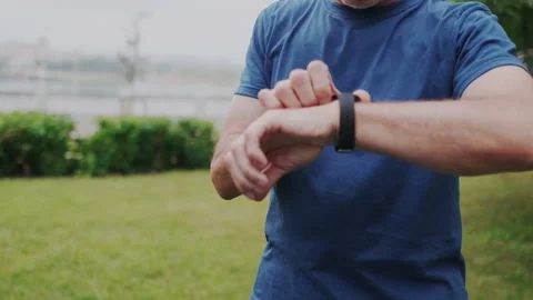 Gray-Haired Old Man Using Smart Watch, Earphones. Starting Training, Jogging Run Stock Footage 148466029