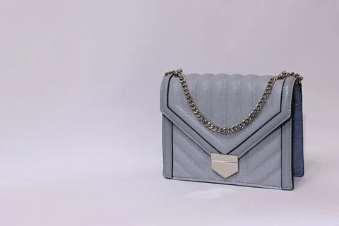 Gray handbag with a silver chain . Stock Photos