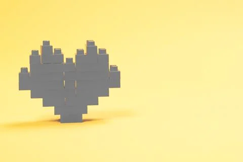 Gray heart made of constructor blocks. Stock Photos