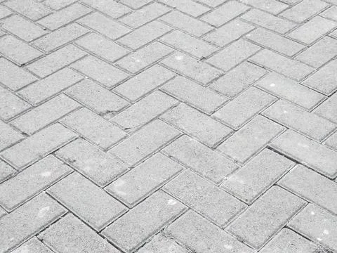 Gray herringbone pavement texture Stock Photos