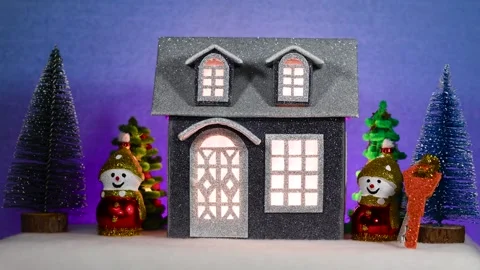 Gray house surrounded by snowmen, keys and Christmas trees Stock Footage 304267222