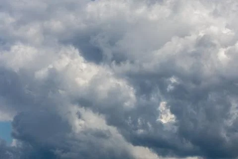 Gray incoming storm clouds dark closeup backdrop 库存照片