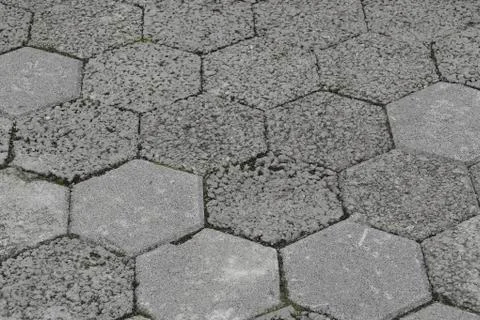 Gray interlocking paving stone driveway directly from above. Stock Photos