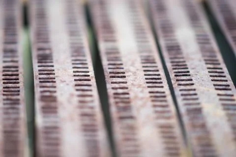 Gray iron grille with perforations, selective focus. Stockfoto's