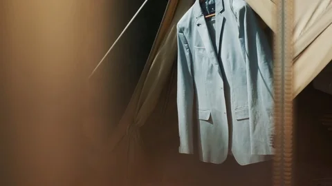 Gray Jacket On Wooden Clothes Rack. Jacket Hangs On A Tent In The Woods. Stock Footage 108741117