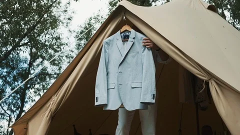 Gray Jacket On Wooden Clothes Rack. Jacket Hangs On A Tent In The Woods. Stock Footage 111799435