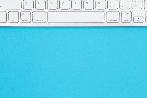 Gray keyboard on a blue background Foto stock