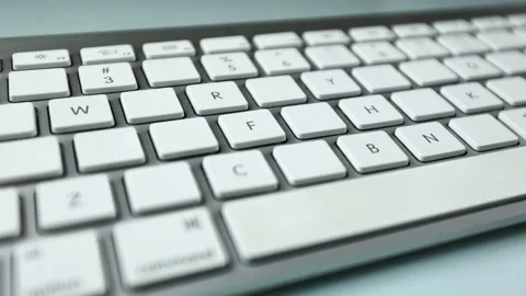 Gray keyboard with white buttons. Wireless keyboard Stock Footage 236938360