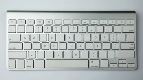 Gray keyboard with white buttons. Wireless keyboard Stock Footage 236938366