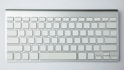 Gray keyboard with white buttons. Wireless keyboard. Computer components Foto stock