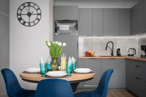 Gray Kitchen and Dining Area with Blue Chairs Stock Photos