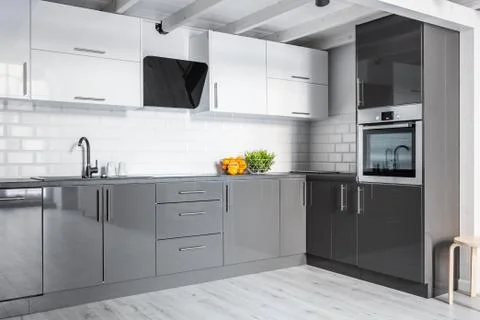 Gray kitchen with brick wall Stock Photos