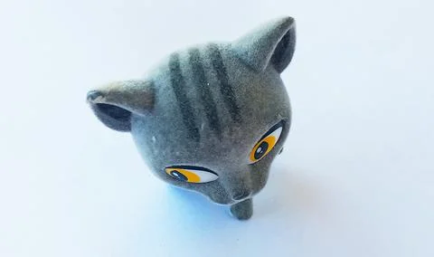 Gray kitten with a big head with three stripes on his head Foto stock