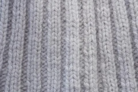 A gray knit texture or background for the design. Stock Photos