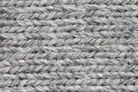 Gray knitted fabric background Stock Photos