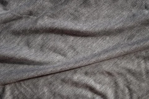 Gray knitted fabric close up. Copy space. Stock Photos
