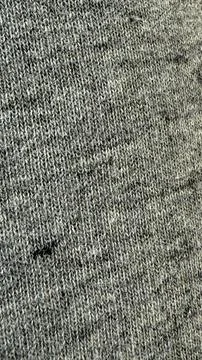 Gray knitted fabric texture with diagonal pattern as background for textile.. Stock Photos