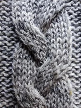 Gray knitted knitted texture for winter textile background Stock Photos