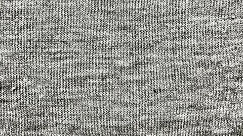 Gray knitted wool fabric texture closeup revealing intricate stitch patterns  Stock Photos