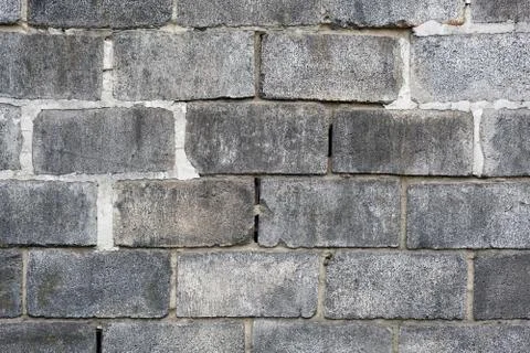Gray large bricks wall. Bricks construction background. Texture of a black wa Foto stock