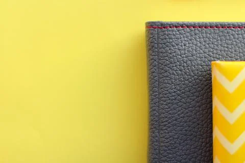 Gray leather diary on a yellow background. the concept of planning. Color of the Fotos de archivo