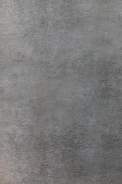Gray leather texture on the wall. The background Stock Photos