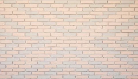 Gray-light pink brick wall baxkground. Brick wall pattern. Stock Photos