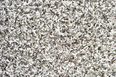 Gray long pile carpet texture background. Top view of bath mat. Stock Photos