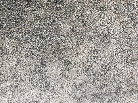 Gray long pile carpet texture background. Top view of bath mat or carpeting. Stock Photos