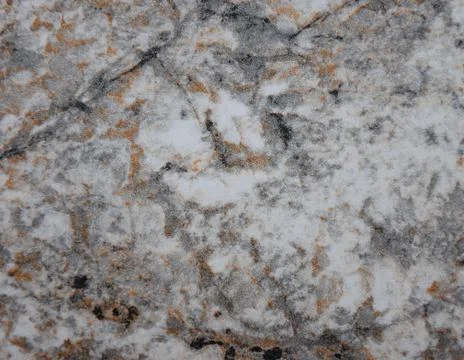 Gray marble, a natural pattern of gray stone with black and orange veins. Stock Photos