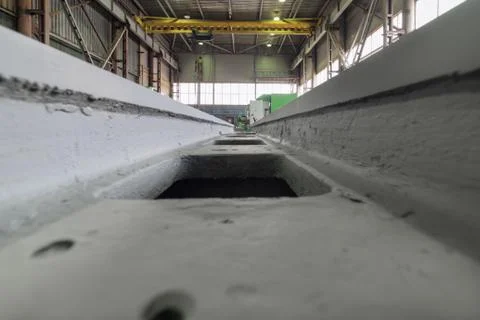 A gray, massive frame of a metal-cutting machine. Stock Photos