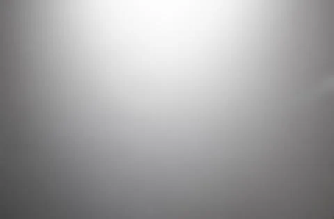 Gray metal background, gradient from white to black . Stock Photos