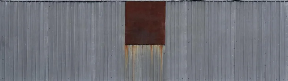 Gray metal decking. Sheets of gray corrugated iron Stock Photos