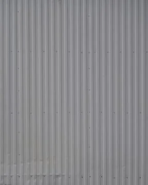 Gray metal decking. Sheets of gray corrugated iron Stock Photos