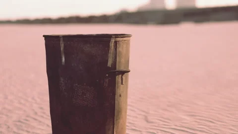 Gray metal garbage bin or trash can on the beach Stock Footage 234132470
