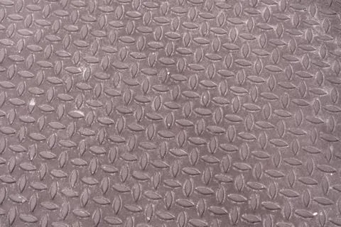 Gray metal texture with repeating leaf designs Stock Photos