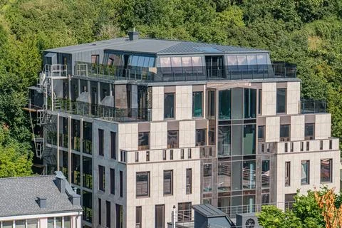Gray, minimalistic multi-level apartment building with geometric shapes in .. 写真素材