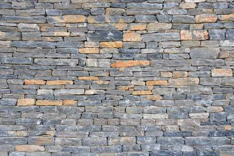 Gray modern pattern of stone wall decorative surfaces. Stock Photos