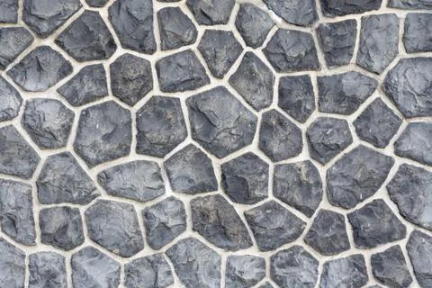 Gray mosaic stone wall background Stock Photos