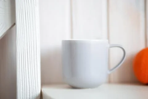 Gray mug on kitchen table Stock Photos
