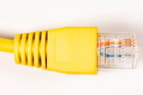 Gray Network Cable with molded RJ45 plug isolated against white background. Stock Photos