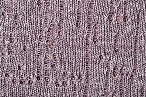 Gray openwork melange stockinet as background Stock Photos