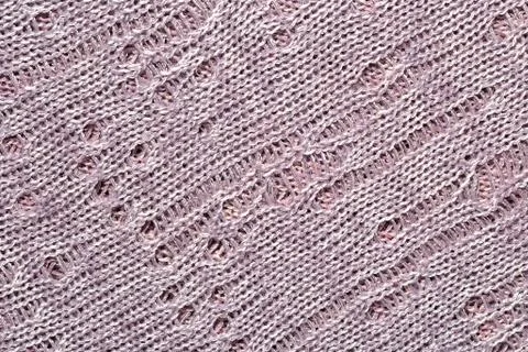 Gray openwork melange stockinet as background Stock Photos