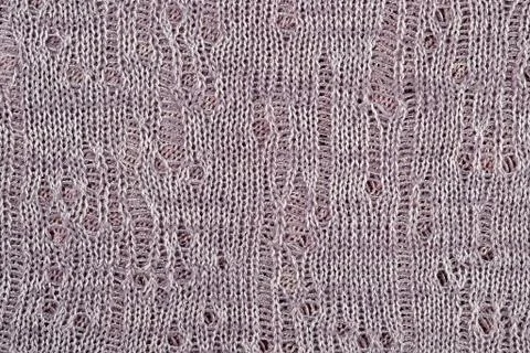 Gray openwork melange stockinet as background Stock Photos