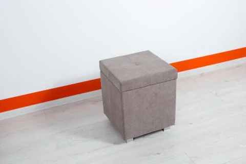 Gray ottoman on a neutral background Stock Photos