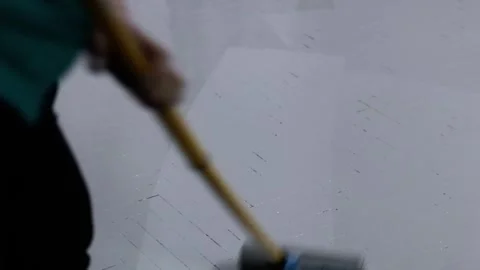 Gray Paint on Herringbone Parquet Flooring with Roller Application. Stock Footage 323460461