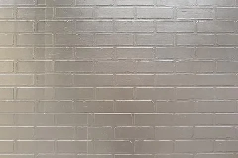 Gray painted wall with brick wall texture. Glossy finish paint. Full frame Stock-Fotos