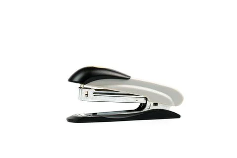 Gray paper stapler isolated on white background. Stock Photos