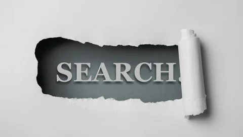 Gray paper is torn over blue background with word "search", stop motion. Stock Footage 121358899