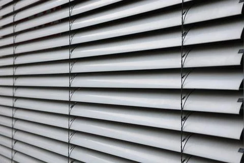 Gray parallel blinds on window Stock Photos